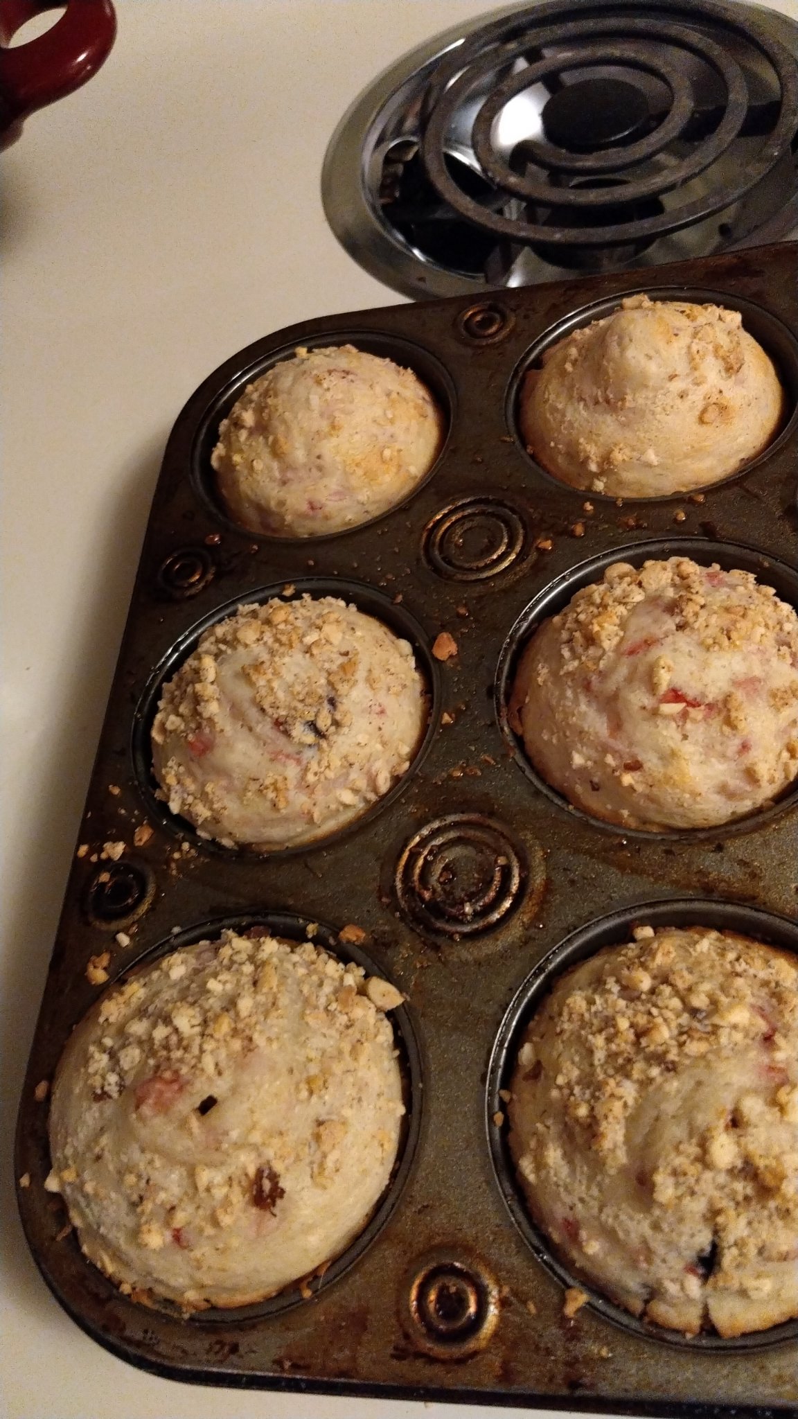 Freshly baked muffins in a muffin tin