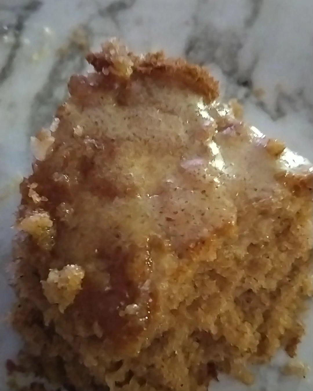 Close-up of a glazed homemade muffin or cake piece