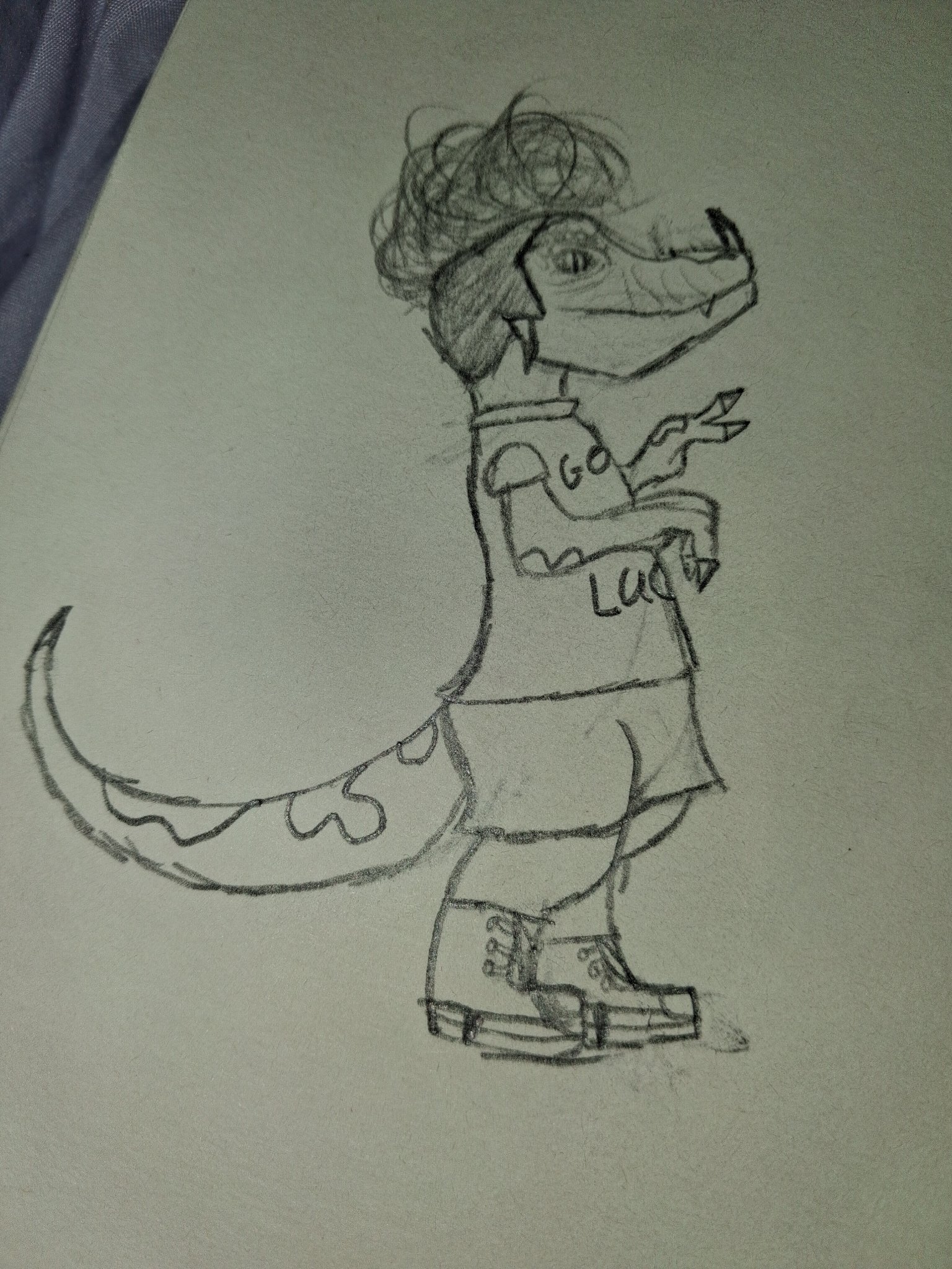 Pencil character sketch of a dinosaur figure in a Good Luck shirt, shorts and boots